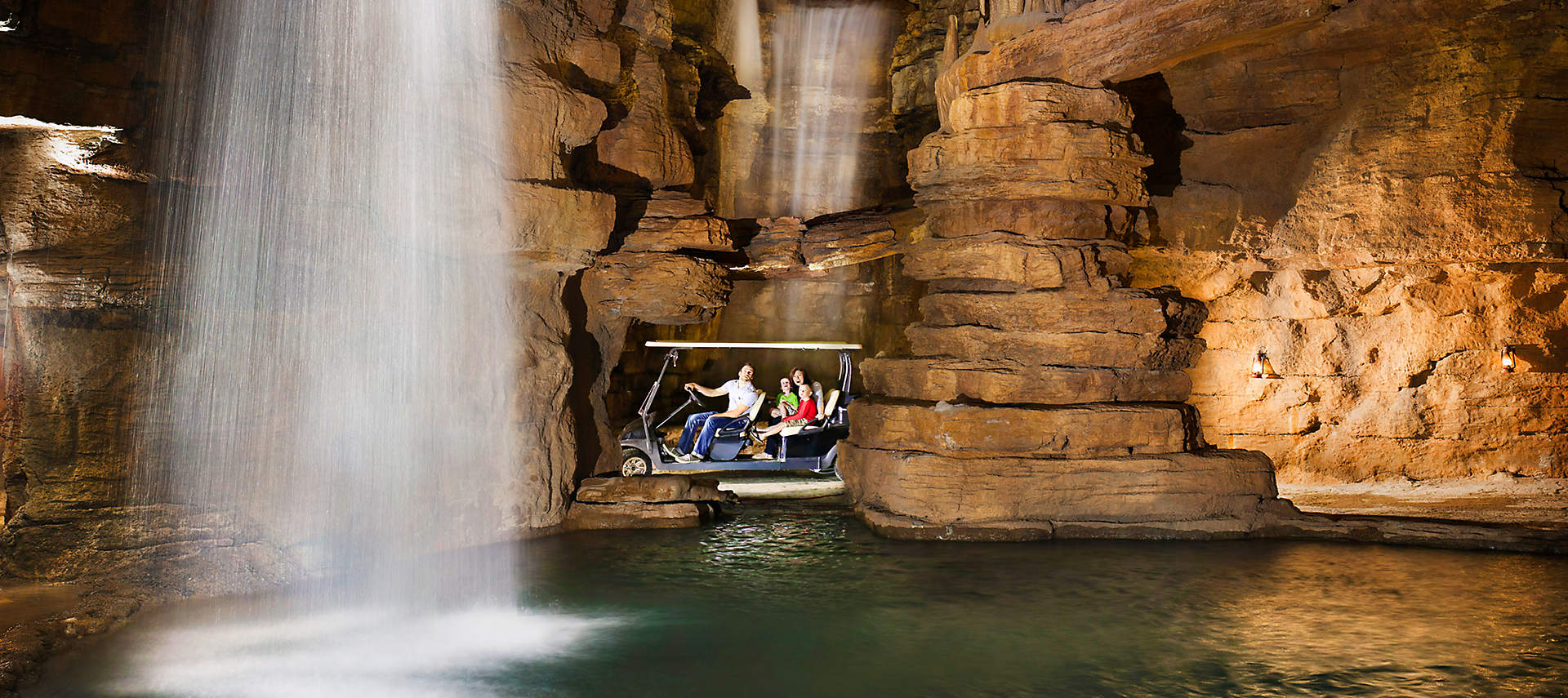 kiosk-ozarks-chateau-cave-interior-falls-w-family
